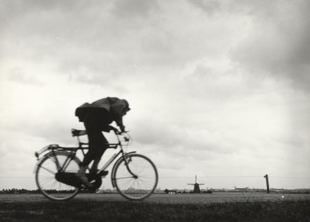 Wim K. Steffen, Cyclist riding against a headwind (1963).