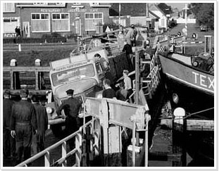 Accident with car and boat on bridge